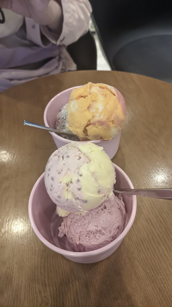 A selection of pink and cream ice-cream scoops